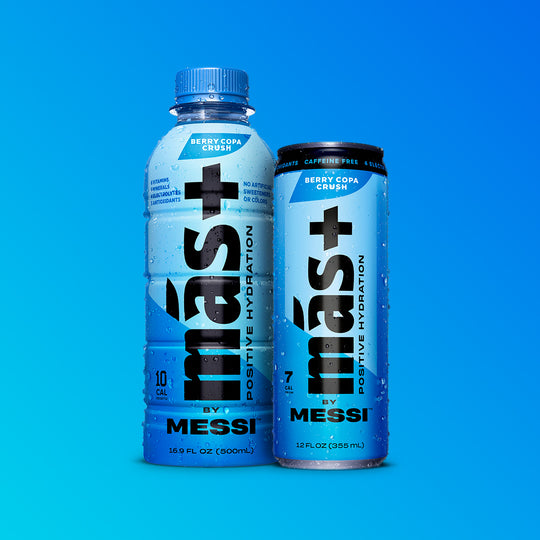 Brightly colored blue Más+ by Messi drinks — Berry Copa Crush flavor — shown side by side on a bold gradient backdrop.