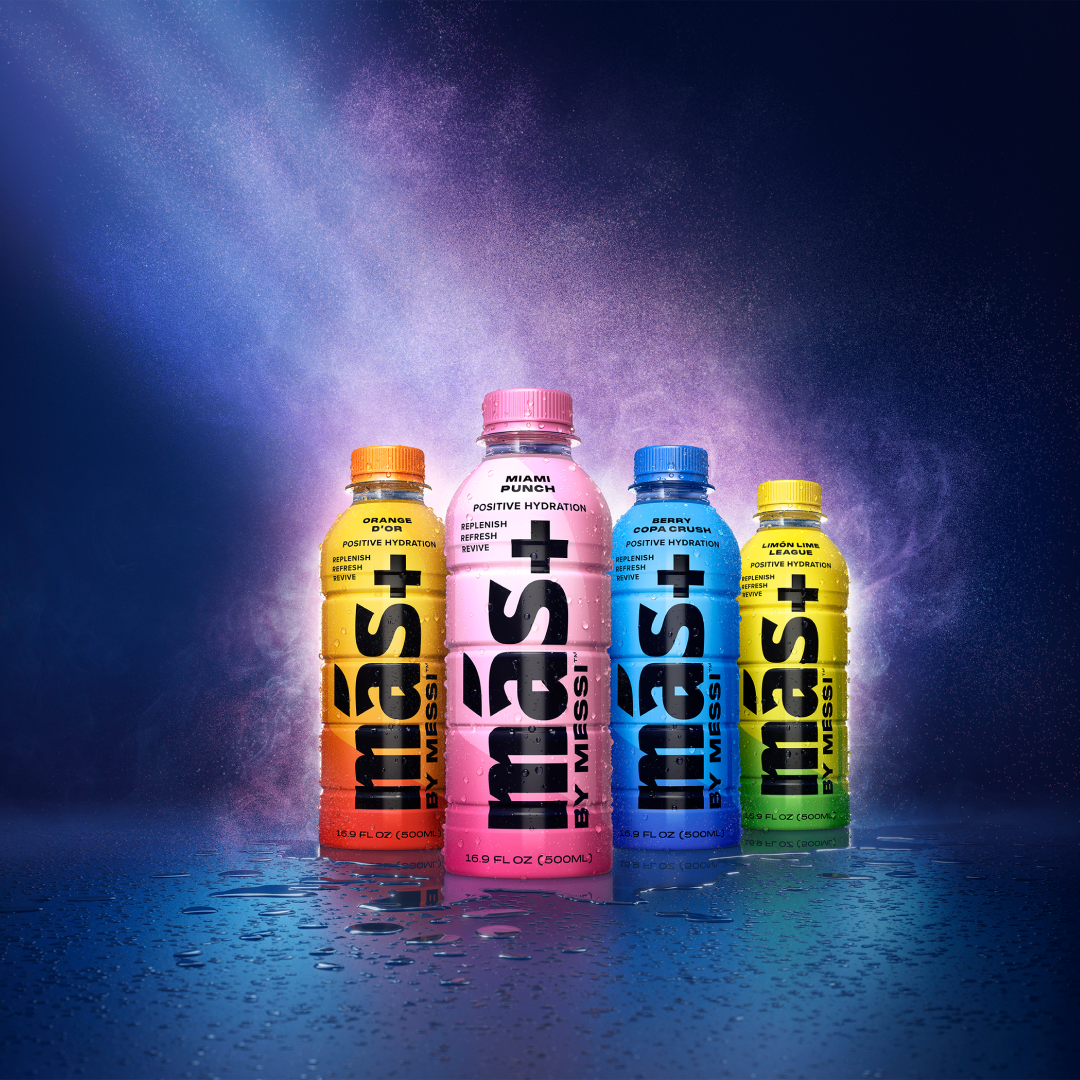 All four delightful Más+ flavors displayed, featuring splashes of water at the base of the bottles.