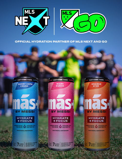 Three 'más by Messi' drink cans (Berry Copa Crush, Miami Punch, Orange d'Or) on a soccer field. MLS Next and MLS GO logos are visible.