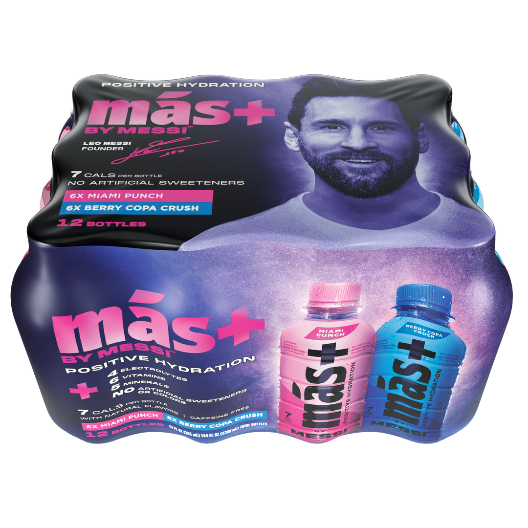 Top view of a más+ by Messi hydration drink 12-pack featuring two standout bottles—pink (Miami Punch) and blue (Berry Copa Crush). The packaging promotes benefits such as 7 calories, 6 essential vitamins, electrolytes, and no caffeine or artificial sweeteners. Set against a sleek black background, the bold and vibrant branding conveys energy, health, and high performance.