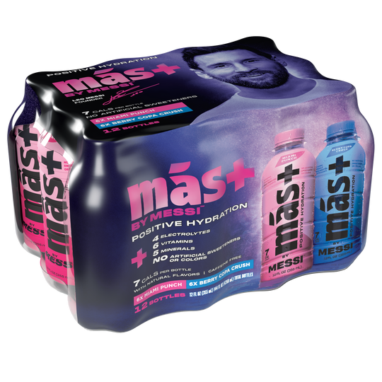 Packaging of más+ by Messi hydration drink 12-pack, featuring a dynamic design with Lionel Messi’s image and two front-facing bottles—one pink (Miami Punch) and one blue (Berry Copa Crush). The package emphasizes benefits like 7 calories, 6 essential vitamins, electrolytes, and no caffeine or artificial sweeteners. Sleek black background with bold, colorful branding conveys energy and performance.