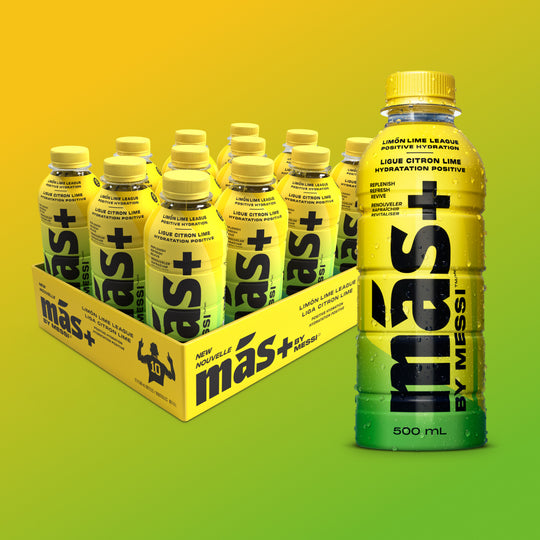 A box of six yellow and green Más+ by Messi bottles labeled 'Limon-Lime League' with one bottle prominently displayed in the front