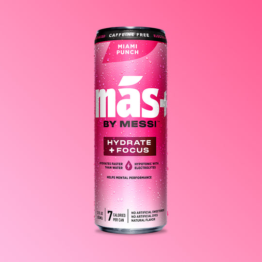 A single, condensation-covered can of Más by Messi Miami Punch flavored, caffeine-free sports drink.
