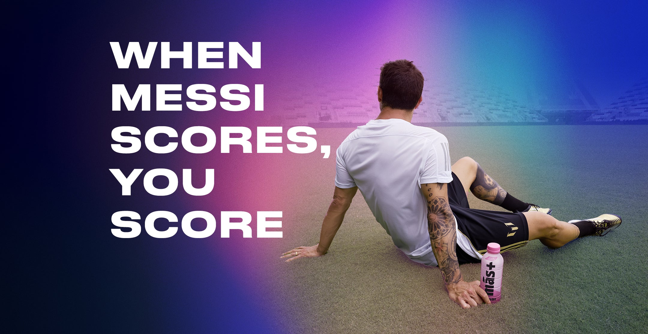 Lionel Messi sits on a soccer field with his back facing the camera, leaning on one arm while resting next to a pink Más+ by Messi hydration drink bottle. The bold white text on the left reads, "WHEN MESSI SCORES, YOU SCORE," set against a gradient background transitioning from deep blue to vibrant pink and purple. The blurred stadium in the background adds depth to the promotional image.